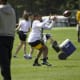 Calvin Austin secures a catch from Kenny Pickett.